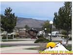 Paved sites and roads with hills in the distance at SUSANVILLE RV PARK - thumbnail