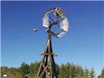 The large windmill in a field at FORT BRIDGER RV PARK - thumbnail