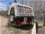 A covered wagon with campground name at FORT BRIDGER RV PARK - thumbnail