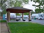 BBQ pits beside covered patio area park at SILVER SAGE RV PARK - thumbnail