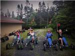 A group of kids riding pedal cars at GROS MORNE/NORRIS POINT KOA - thumbnail