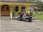A golf cart in front of the office at COUNTRY SIDE RV PARK - thumbnail