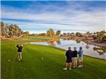 Group of golfers teeing off at PUEBLO EL MIRAGE RV & GOLF RESORT - thumbnail