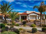 Palm trees with main building in distance at PUEBLO EL MIRAGE RV & GOLF RESORT - thumbnail