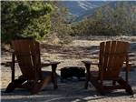 Two chairs next to a fire pit at STAGECOACH TRAILS RV PARK - thumbnail