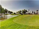 Wide view of resort grounds with water fountain at GOLD CANYON RV & GOLF RESORT - thumbnail