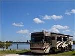 A Class A motorhome by the water at NATURE'S RESORT - thumbnail