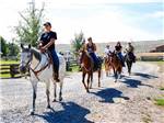 People riding on horses at THE LONGHORN RANCH LODGE AND RV RESORT - thumbnail