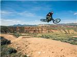 A person jumping on a mountain bike at THE LONGHORN RANCH LODGE AND RV RESORT - thumbnail