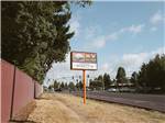 Welcome sign outside entrance at NINETY-9 RV PARK - thumbnail