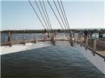 Modern bridge over water at NINETY-9 RV PARK - thumbnail