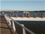 Long pier facing out to beautiful water views at NINETY-9 RV PARK - thumbnail