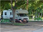 Couple camping in RV at COLORADO LANDING RV PARK - thumbnail