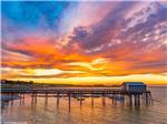 A pier and boat dock at sunset at MARDON RESORT ON POTHOLES RESERVOIR - thumbnail