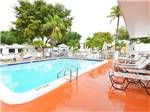 Swimming pool with outdoor seating at ENCORE SUNSHINE HOLIDAY - thumbnail