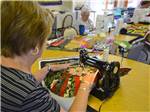 Women sewing at CANYON VISTAS RV RESORT - thumbnail