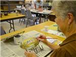Women painting at CANYON VISTAS RV RESORT - thumbnail
