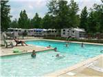 People swimming in the pool at LAKE PINES RV PARK & CAMPGROUND - thumbnail