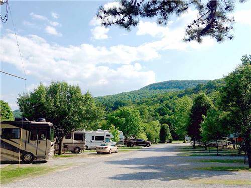 RVs pulled in at gravel sites at LAKESIDE RV PARK