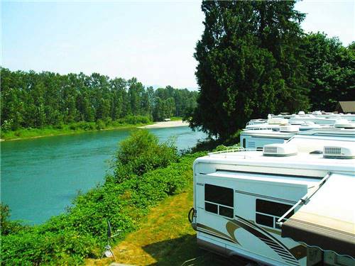 Trailers camping along the river at THOUSAND TRAILS THUNDERBIRD