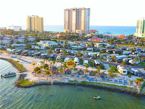 An aerial view from the water of the RV sites at PENSACOLA BEACH RV RESORT