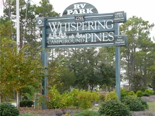 Sign of the park entrance at WHISPERING PINES CAMPGROUND