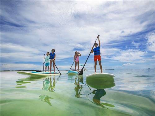 A family paddle boarding nearby at BIG PINE KEY & FLORIDA LOWER KEYS
