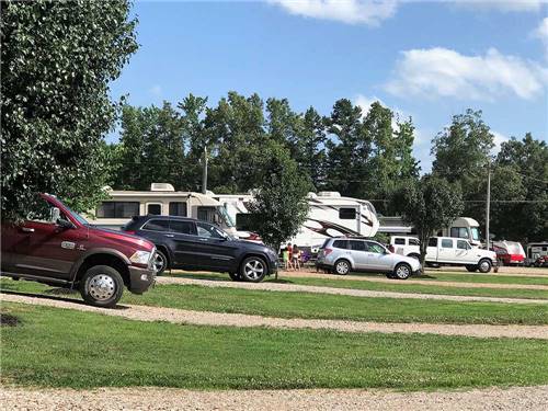 A row of long gravel RV sites at GREEN ACRES RV PARK