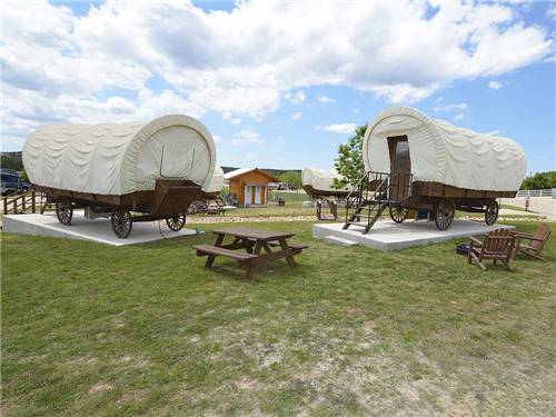 Some of the rental covered wagon cabins at THE VINEYARDS OF FREDERICKSBURG RV PARK