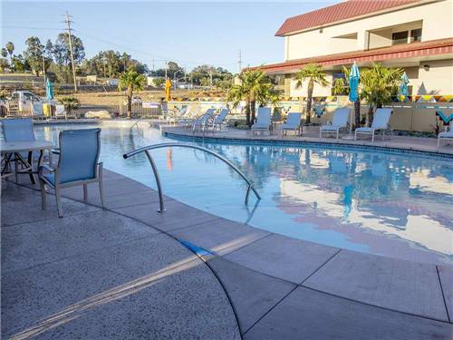 Swimming pool with outdoor seating at BERRY CREEK RANCHERIA RV PARK