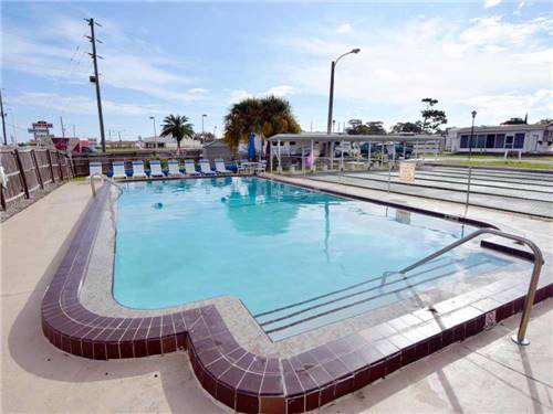 The outdoor pool next to the shuffleboard courts at WINTER PARADISE RV RESORT