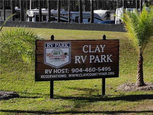Welcome sign at park entrance at CLAY FAIR RV PARK