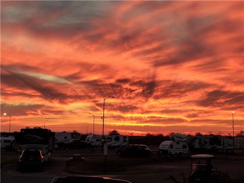 A view of the campground at sunset at LAKE CHARLES RV RESORT BY RJOURNEY