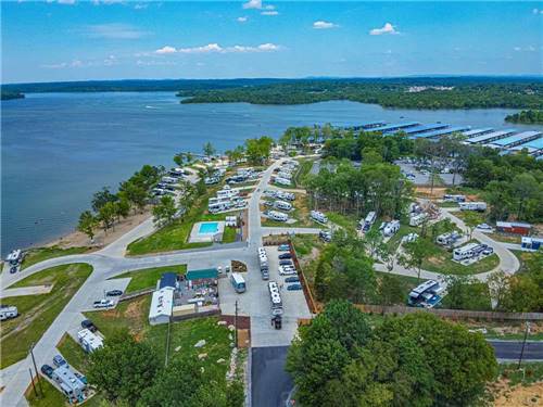 An aerial view of the campsites by the water at FOUR CORNERS RV RESORT