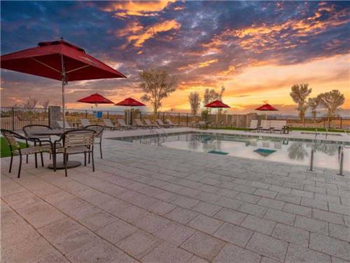 The swimming pool at sunset at RIVER SANDS RV RESORT
