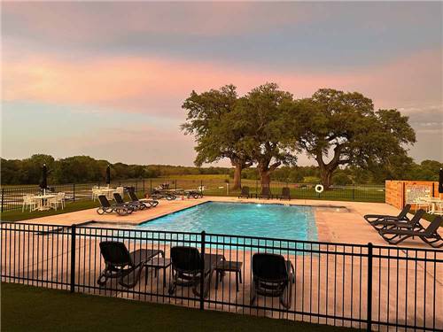 A view of the swimming pool at THE HILL TOP AT BRENHAM RV RESORT