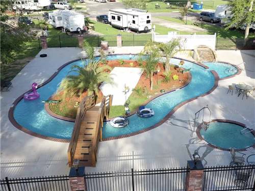 An aerial view of the lazy river in the daytime at TWELVE OAKS RV PARK