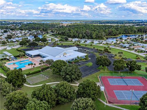 An aerial view of the tennis courts and swimming pool at OUTBACK RV RESORT AT TANGLEWOOD