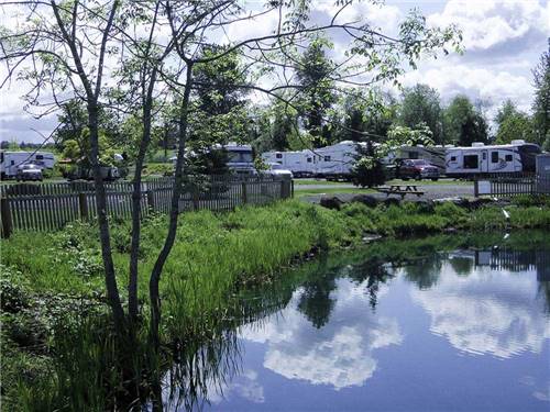 Trailers camping on the water at SILVER SPUR RV PARK & RESORT