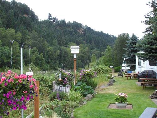 Birdhouses and flowers at SANDY RIVERFRONT RV RESORT