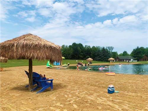 The sandy beach on the water at AMERICAN WILDERNESS CAMPGROUND