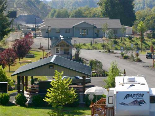 Aerial view of clubhouse with mountains in background at TOUTLE RIVER RV RESORT