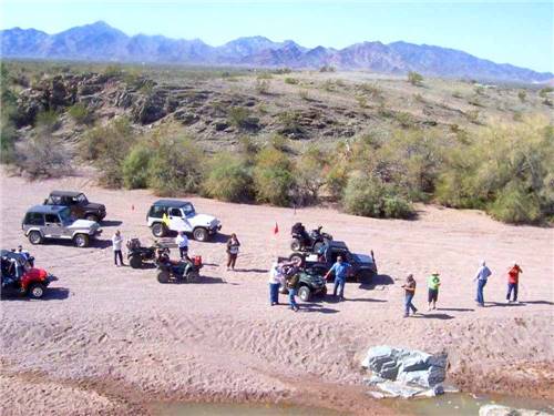 A group of people with off road vehicles at 3 DREAMERS RV PARK
