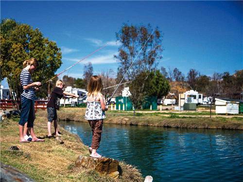 Kids fishing at THOUSAND TRAILS WILDERNESS LAKES RV RESORT