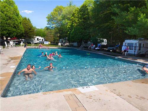 People swimming in the pool at CIRCLE CG FARM CAMPGROUND