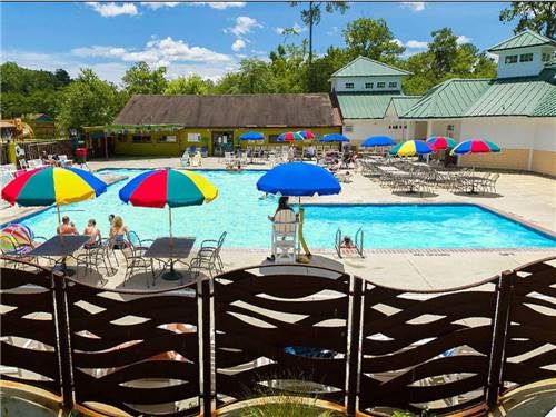 Swimming pool with outdoor seating at HOLIDAY TRAV-L-PARK