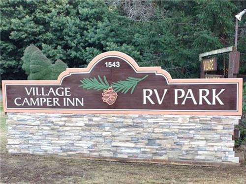 Sign at entrance to RV park at VILLAGE CAMPER INN RV PARK