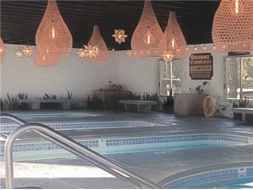The indoor swimming pools with hanging lanterns at SAM'S FAMILY SPA AND RESORT