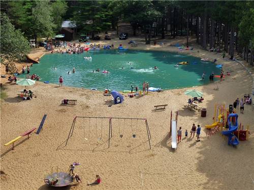 Families enjoying the swimming pond at PEARL LAKE RV CAMPGROUND BY RJOURNEY