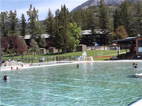 People swimming in the large pool at FAIRMONT HOT SPRINGS RESORT